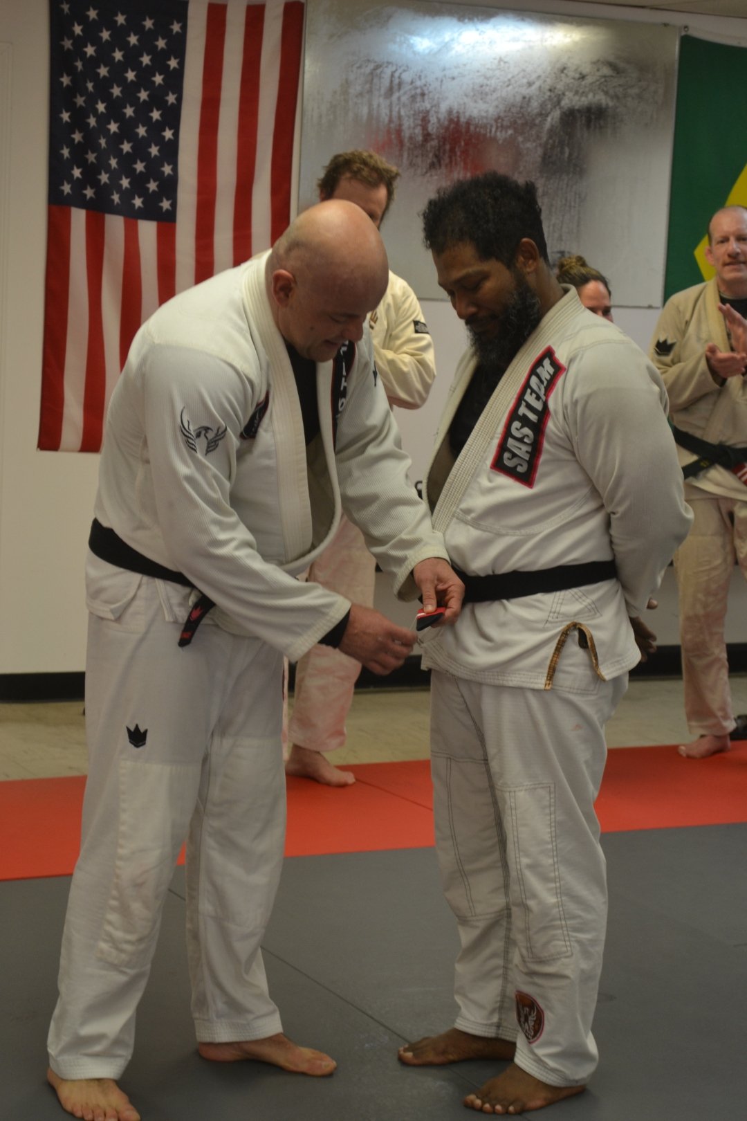 Coach O at BJJ belt promotion ceremony