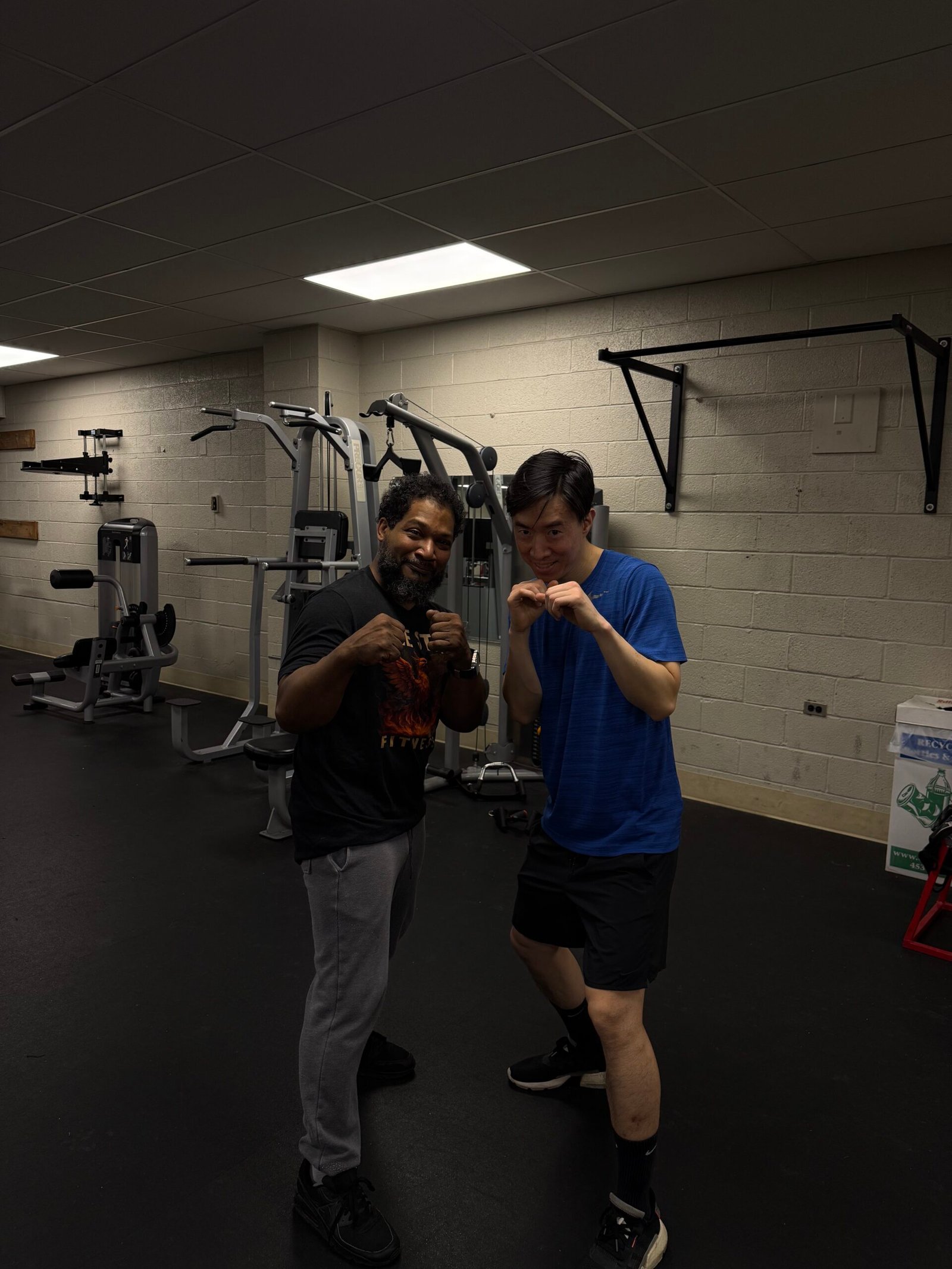 Coach O working with a client in boxing stance